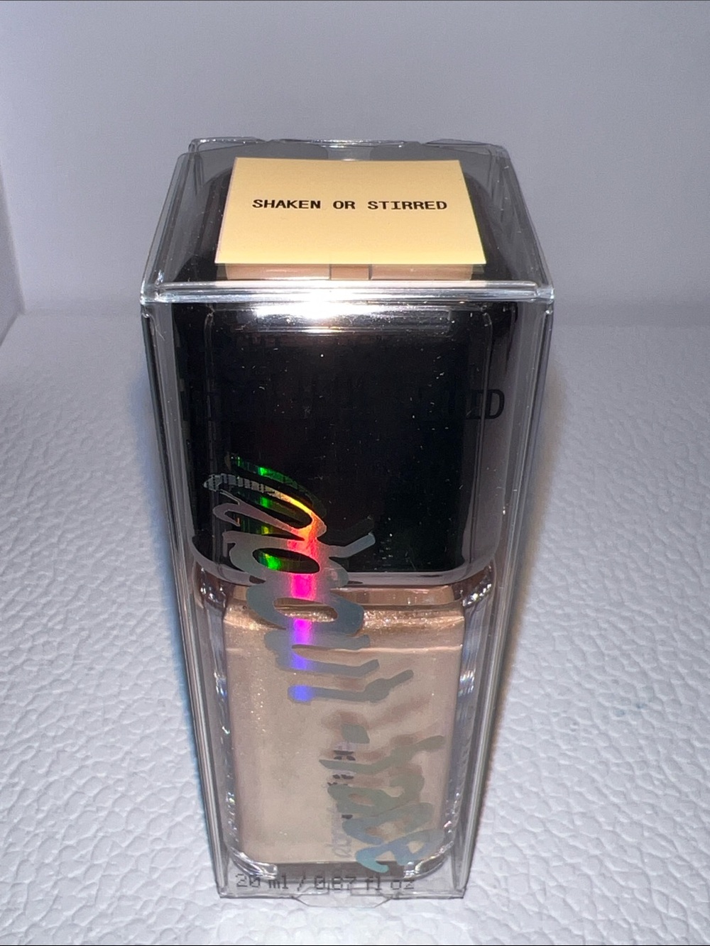 About-Face Light Lock Highlight Fluid- Shaken or Stirred- shimmering gold